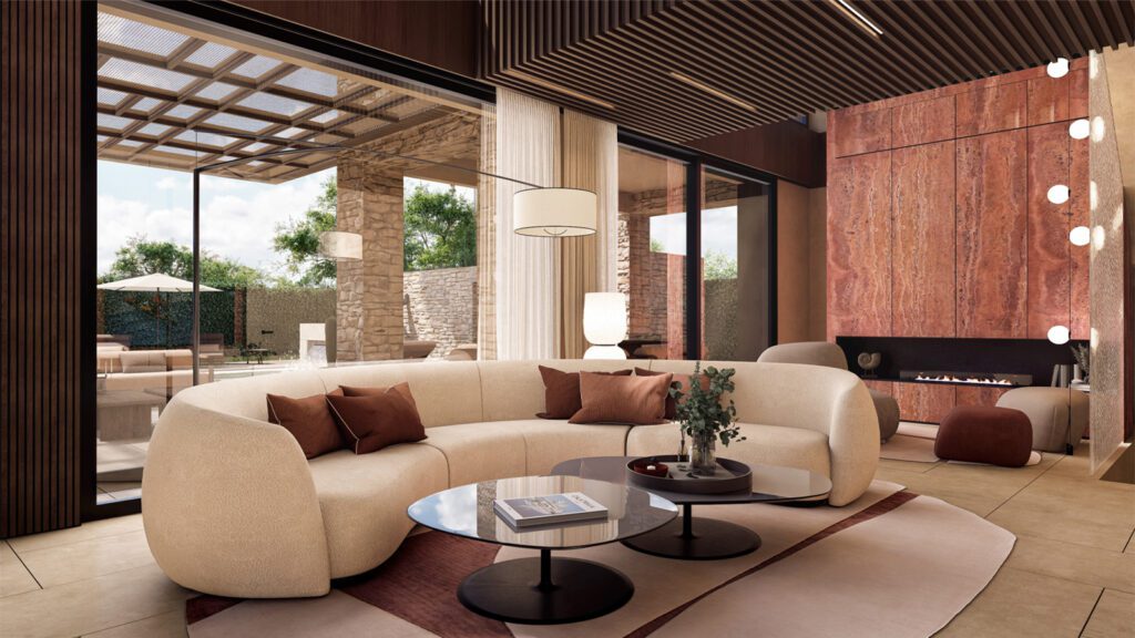 Soggiorno elegante di una villa in vendita a Forte dei Marmi con divano curvo beige, tavolini moderni e camino a bioetanolo, vista sul giardino tramite ampie vetrate di una villa contemporanea